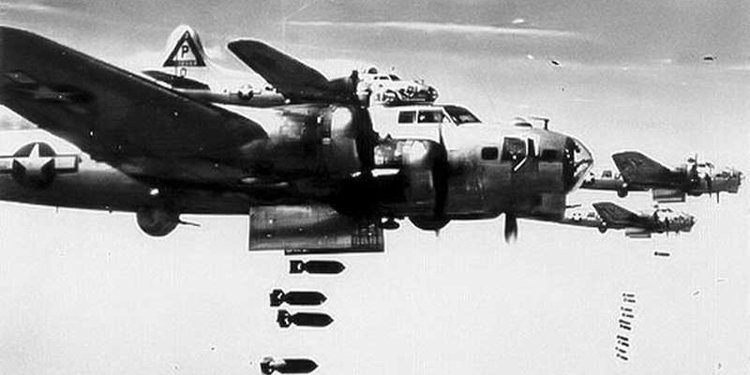 A b17 flying fortress drops its bombs during ww2.