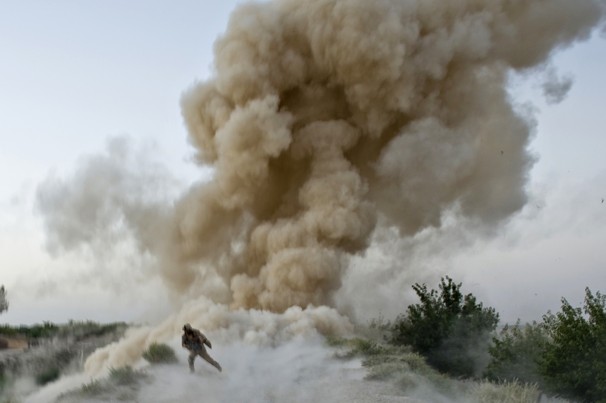 An IED explodes during the Iraq War injuring several soldiers on patrol.